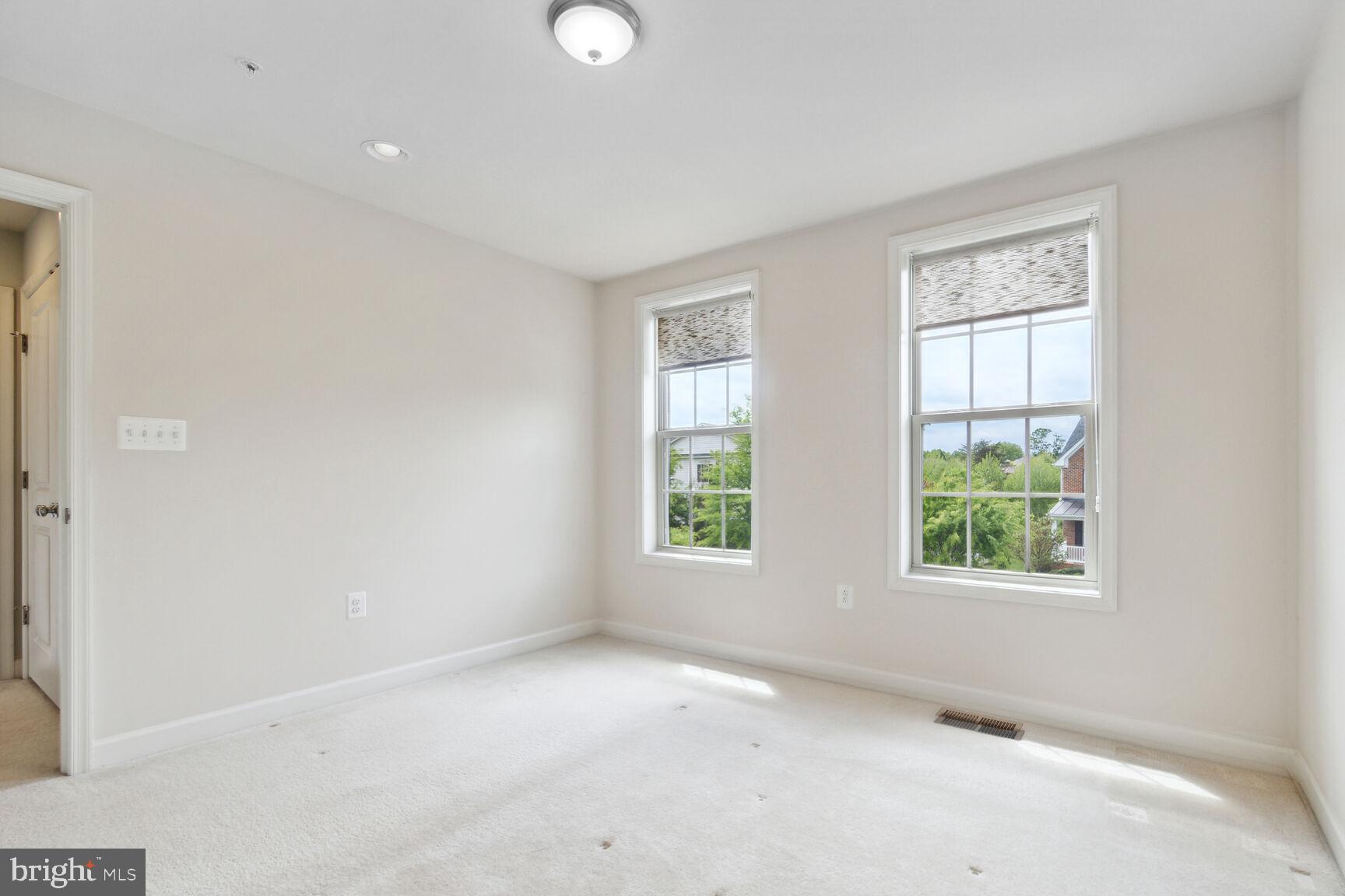 13601 Soaring Wing Lane Silver Spring, MD 20906 - Photo 17 of 53 an empty room with windows