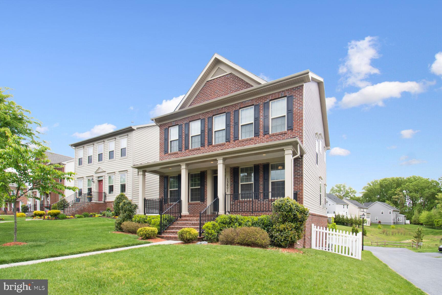 13601 Soaring Wing Lane Silver Spring, MD 20906 - Photo 2 of 53 a front view of a house with garden and porch
