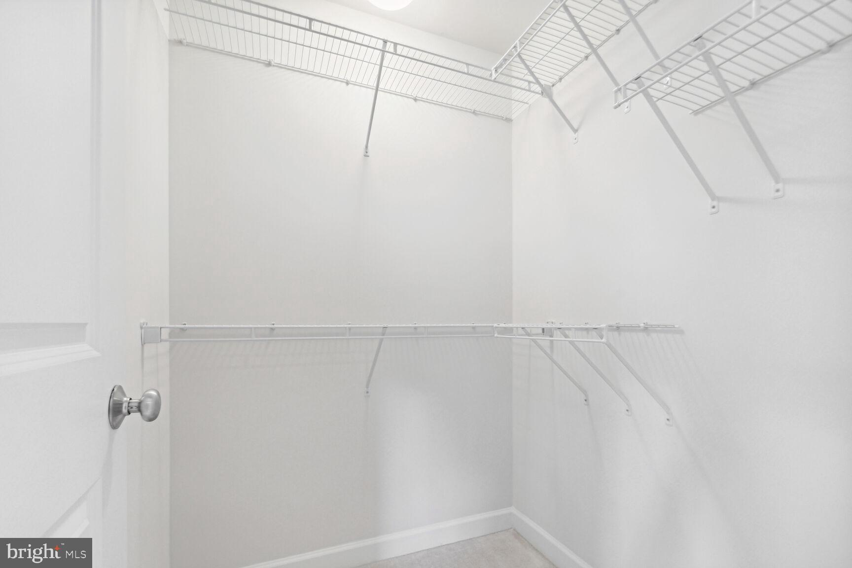 13601 Soaring Wing Lane Silver Spring, MD 20906 - Photo 28 of 53 a view of a room with racks on the wall