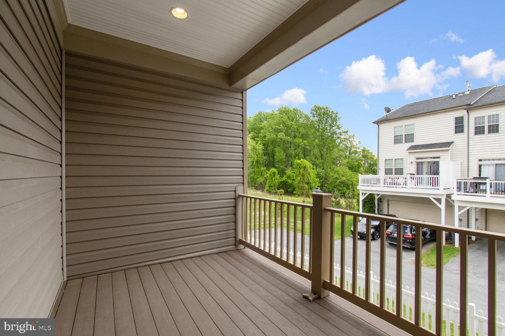 13601 Soaring Wing Lane Silver Spring, MD 20906 - Photo 39 of 53 a view of a balcony with wooden floor