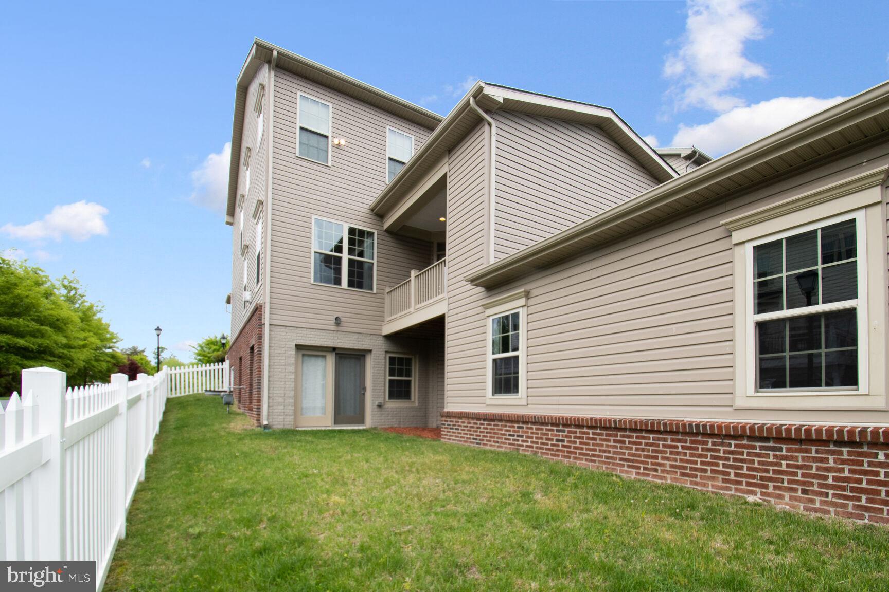 13601 Soaring Wing Lane Silver Spring, MD 20906 - Photo 41 of 53 a front view of a house with a garden