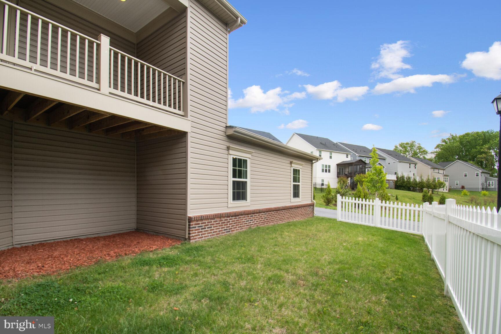 13601 Soaring Wing Lane Silver Spring, MD 20906 - Photo 43 of 53 a view of a backyard with a garden