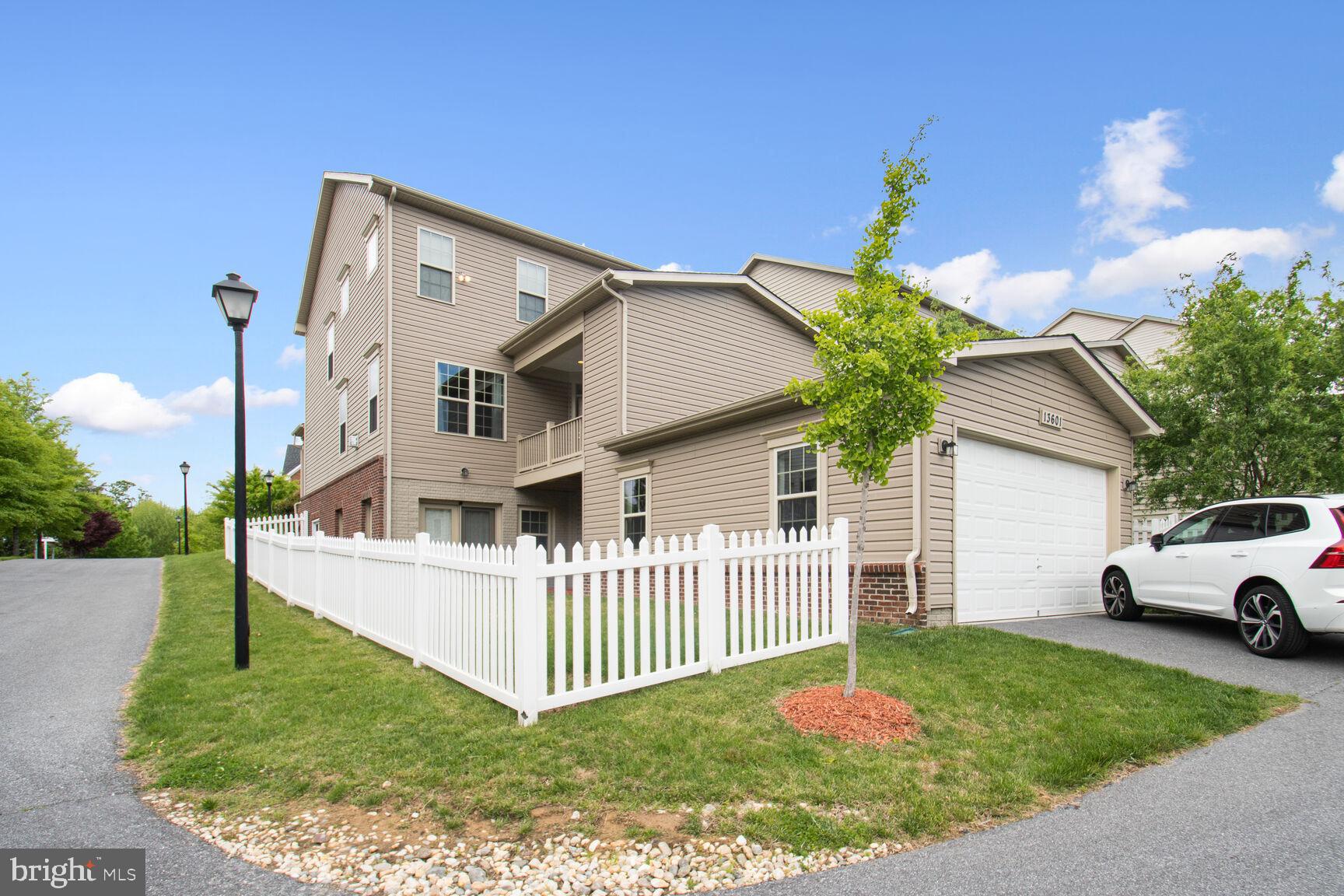 13601 Soaring Wing Lane Silver Spring, MD 20906 - Photo 44 of 53 a white house that has tree in front of it