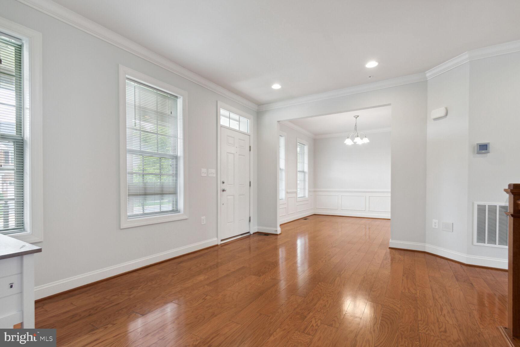 13601 Soaring Wing Lane Silver Spring, MD 20906 - Photo 5 of 53 an empty room with wooden floor and windows