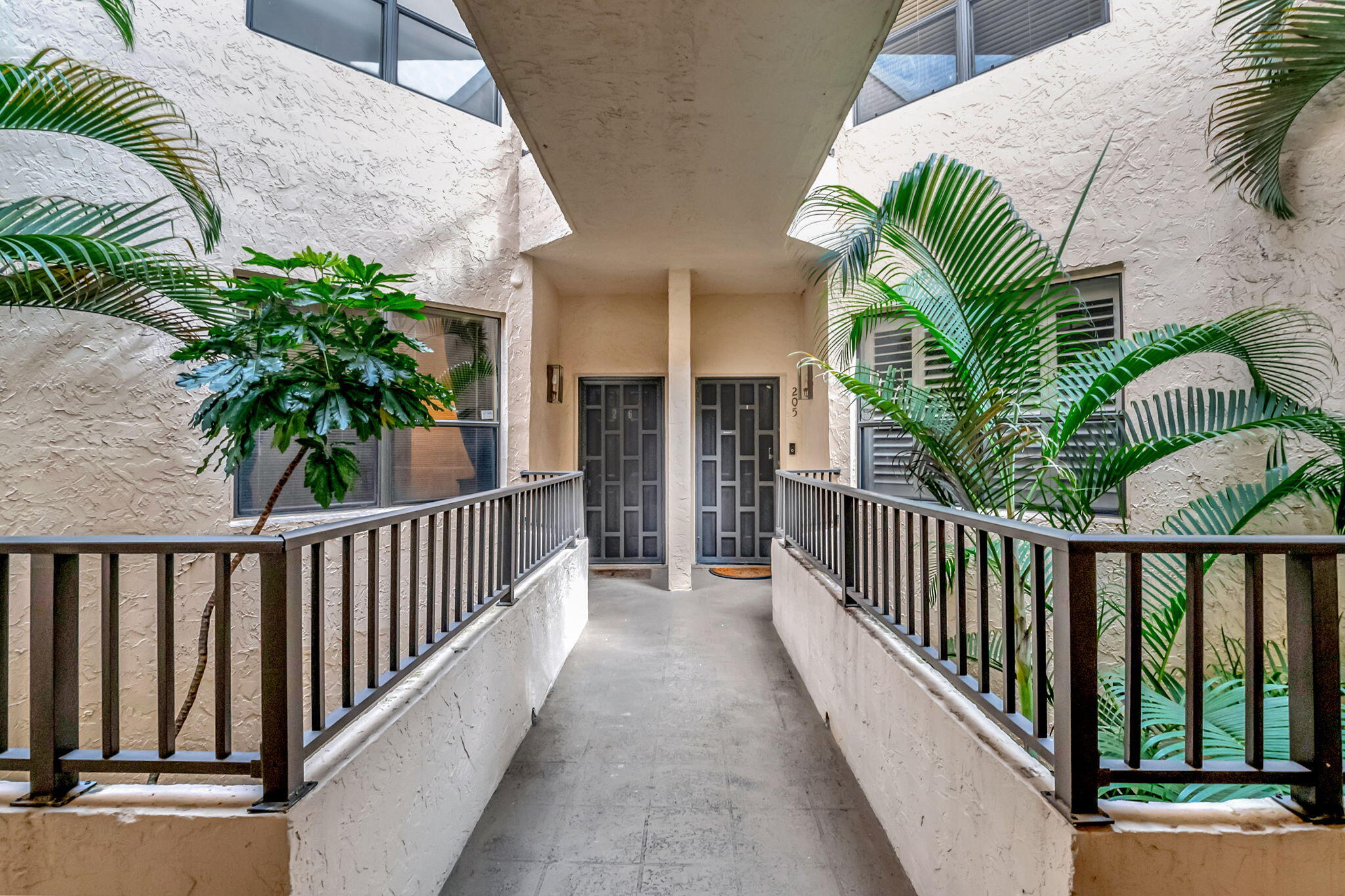7460 La Paz Boulevard, Unit 206 Boca Raton, FL 33433 - Photo 3 of 37 Exterior catwalk