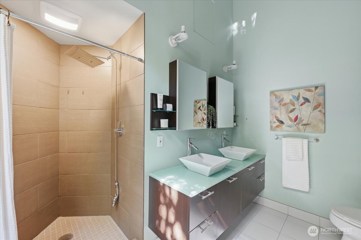 9418 Odin Way Bothell, WA 98011 - Photo 25 of 39 a bathroom with a sink toilet and shower