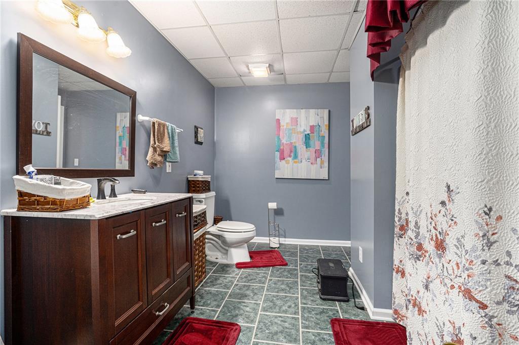 2170 Taylorsville Road Taylorsville, GA 30178 - Photo 15 of 48 a bathroom with a sink vanity mirror and toilet