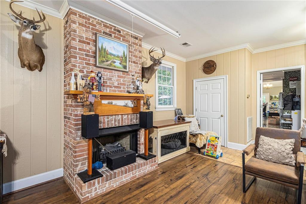 2170 Taylorsville Road Taylorsville, GA 30178 - Photo 34 of 48 a living room with furniture and a fireplace