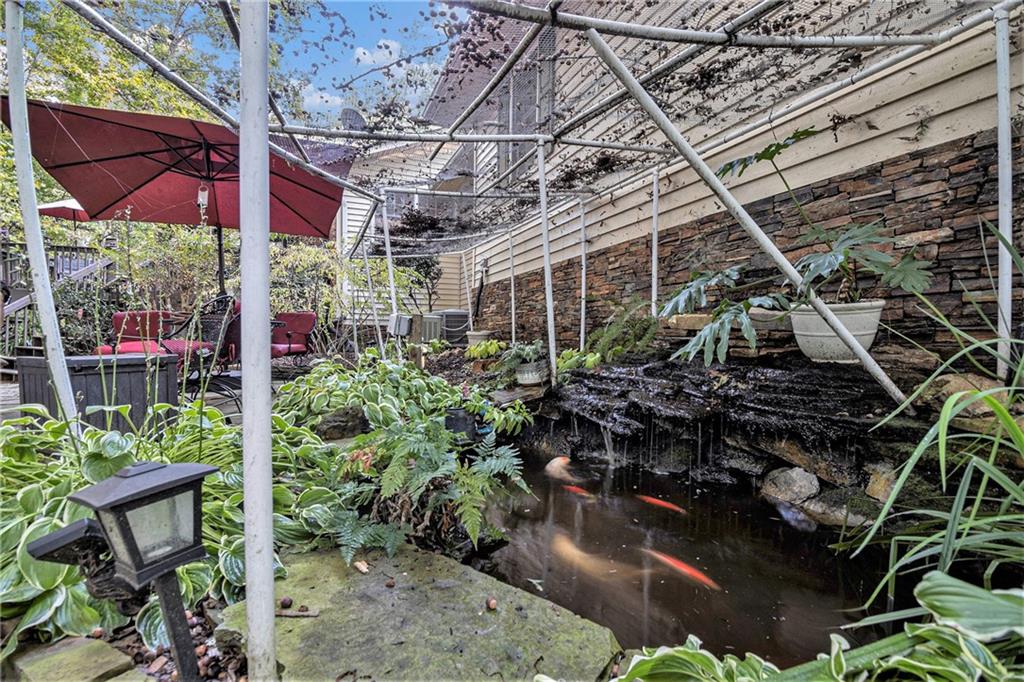 2170 Taylorsville Road Taylorsville, GA 30178 - Photo 37 of 48 a view of a chairs and table in a backyard