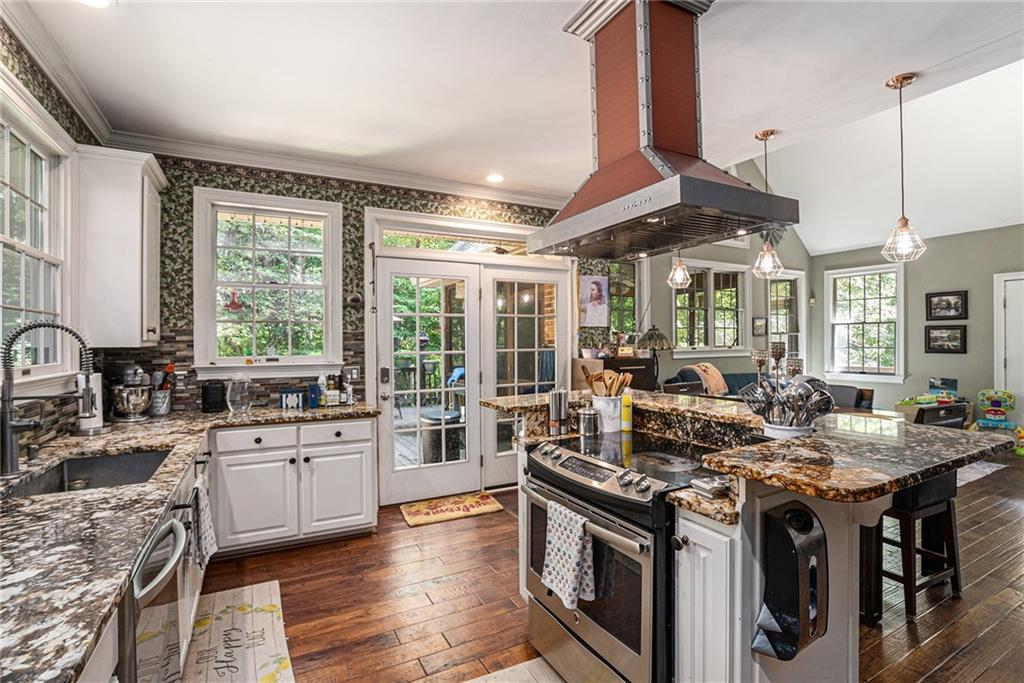 2170 Taylorsville Road Taylorsville, GA 30178 - Photo 4 of 48 a kitchen with stainless steel appliances granite countertop a stove and a sink