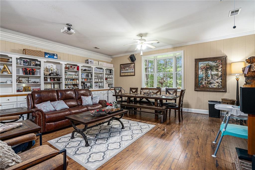 2170 Taylorsville Road Taylorsville, GA 30178 - Photo 6 of 48 a living room with furniture or couch and a dining table