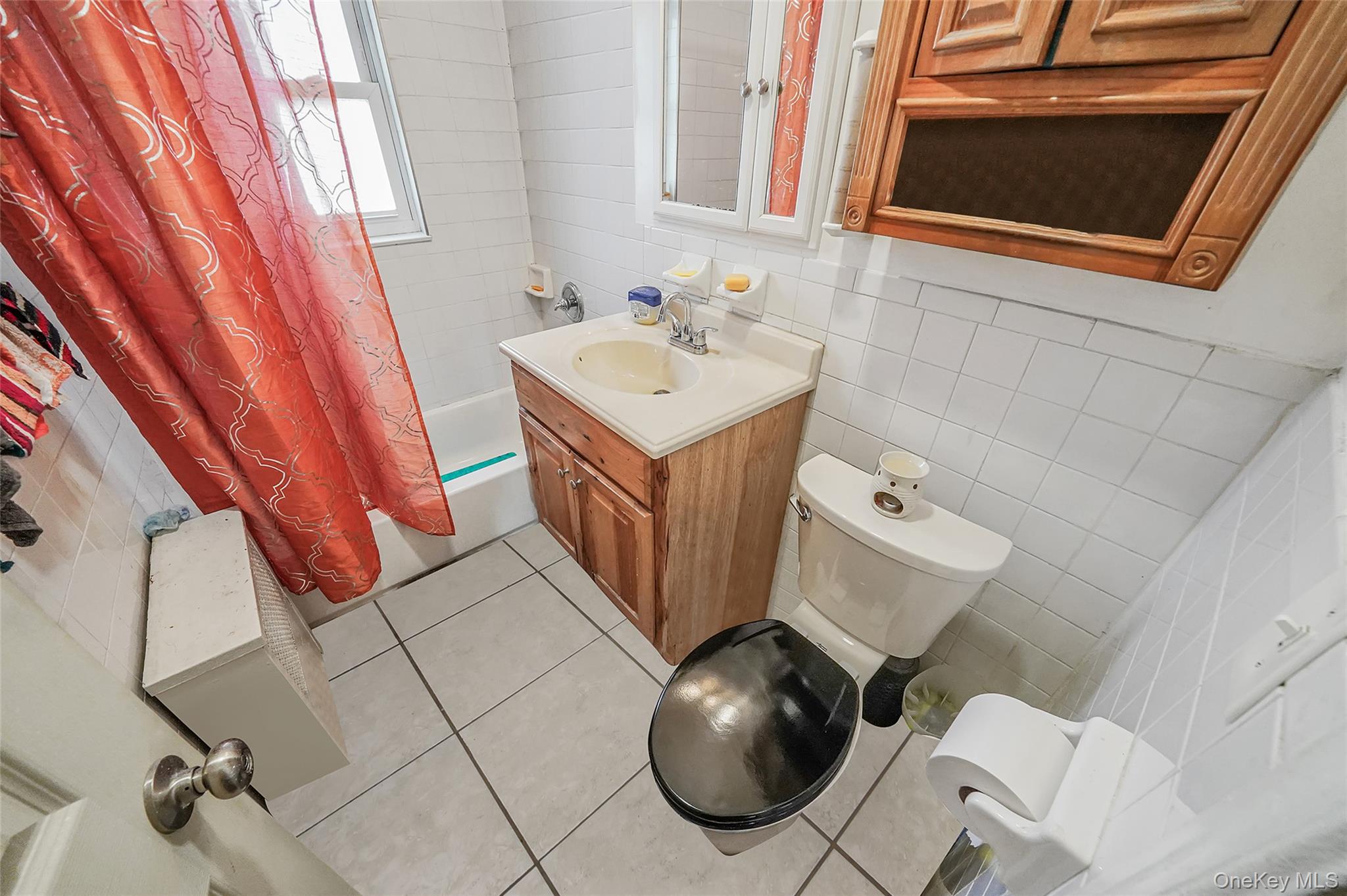 141 Branton Street Brooklyn, NY 11236 - Photo 12 of 20 a bathroom with a sink and mirror