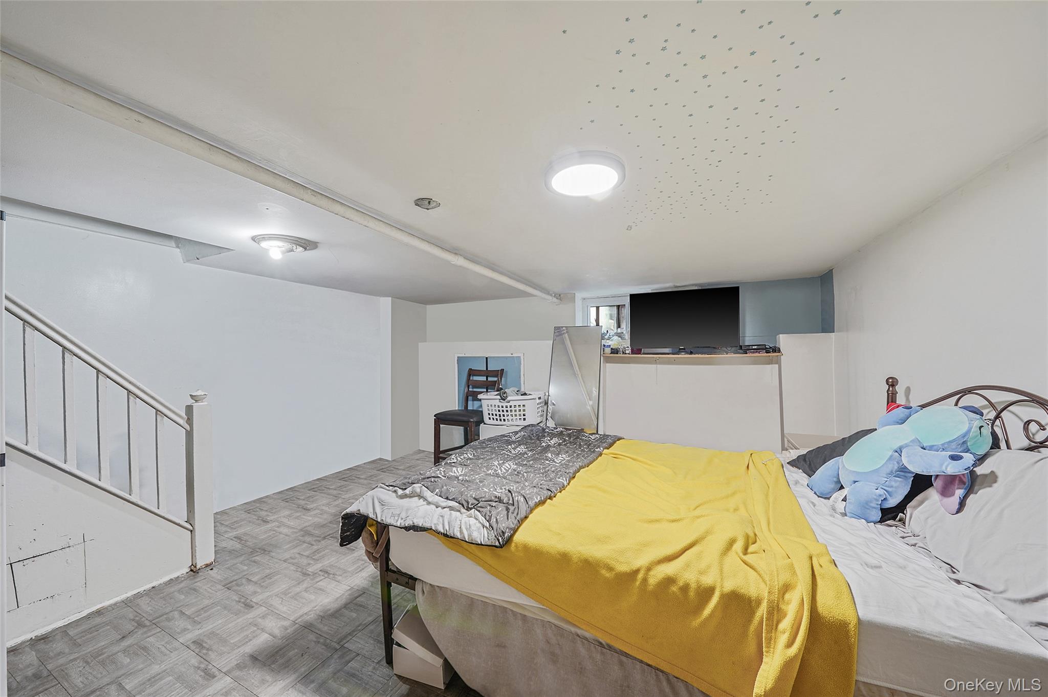 141 Branton Street Brooklyn, NY 11236 - Photo 14 of 20 a bed room with a bed and a television