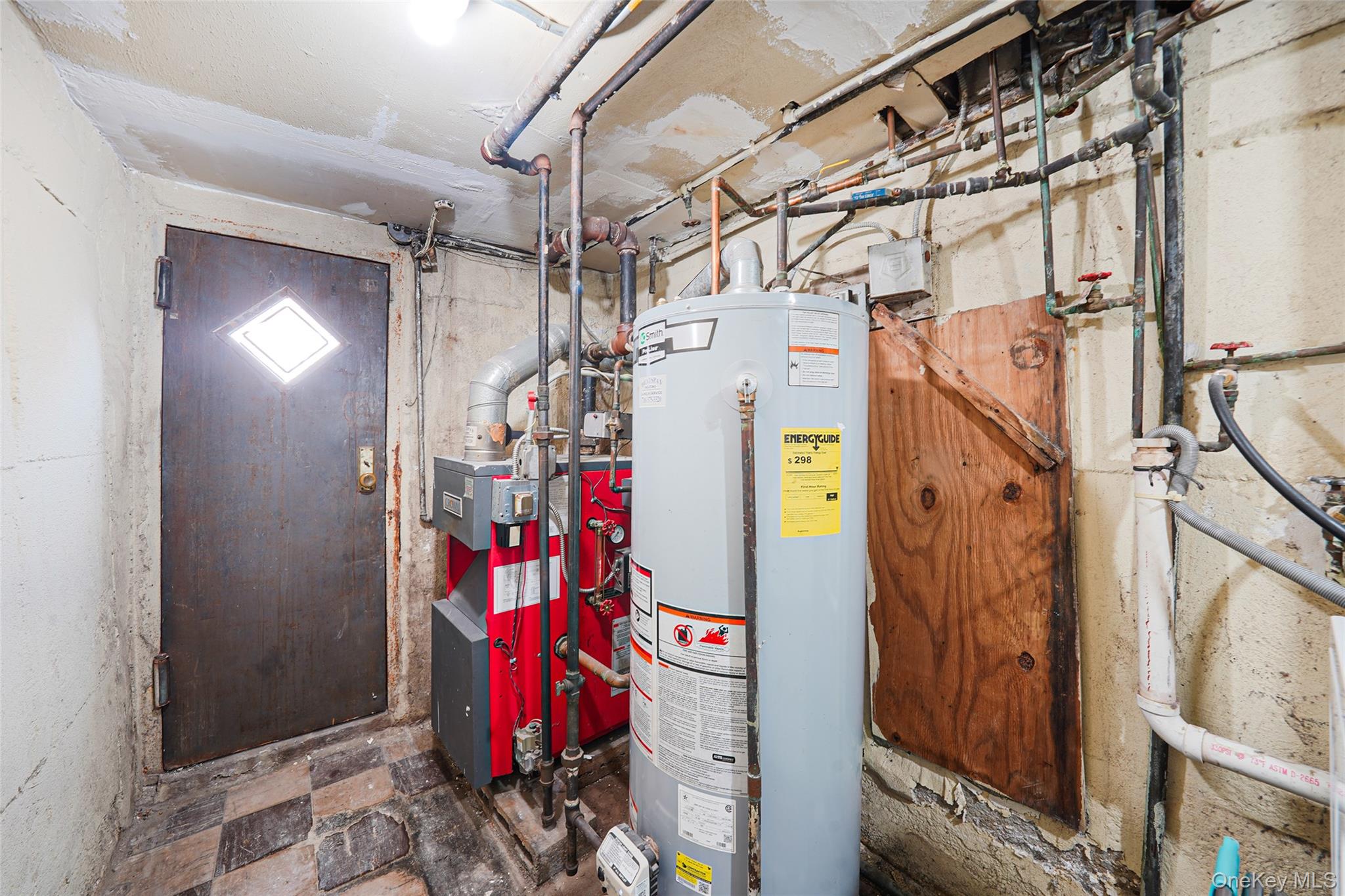 141 Branton Street Brooklyn, NY 11236 - Photo 17 of 20 a utility room with refrigerator and washer