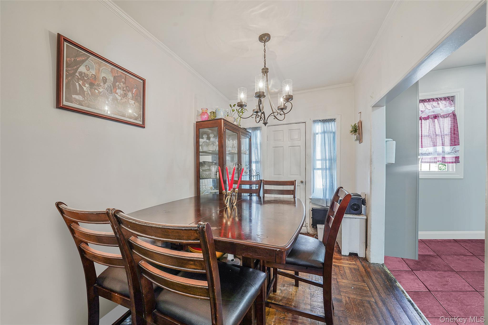 141 Branton Street Brooklyn, NY 11236 - Photo 5 of 20 a view of a dining room with furniture a chandelier and wooden floor