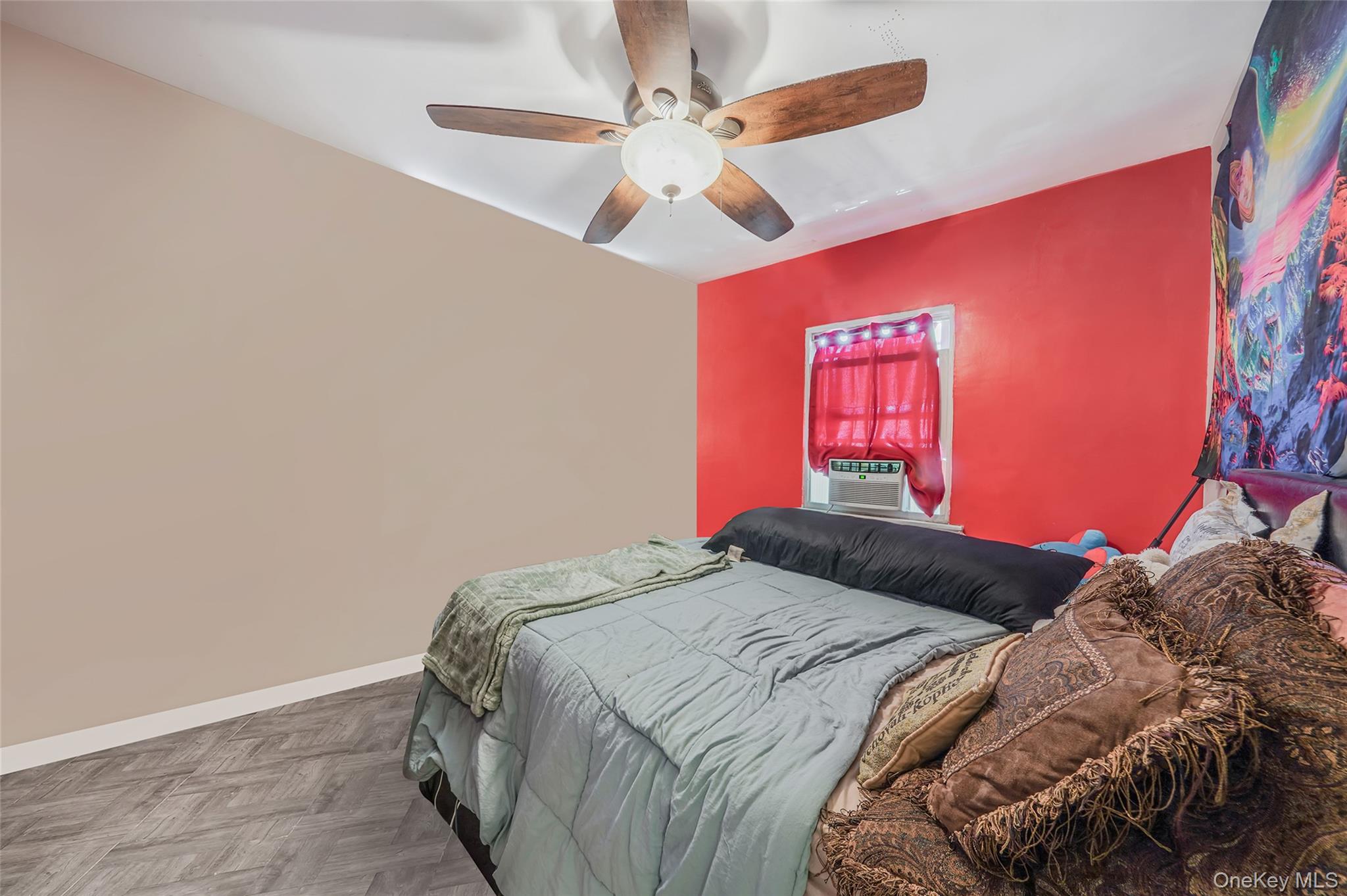 141 Branton Street Brooklyn, NY 11236 - Photo 10 of 20 a bedroom with a bed and a chandelier