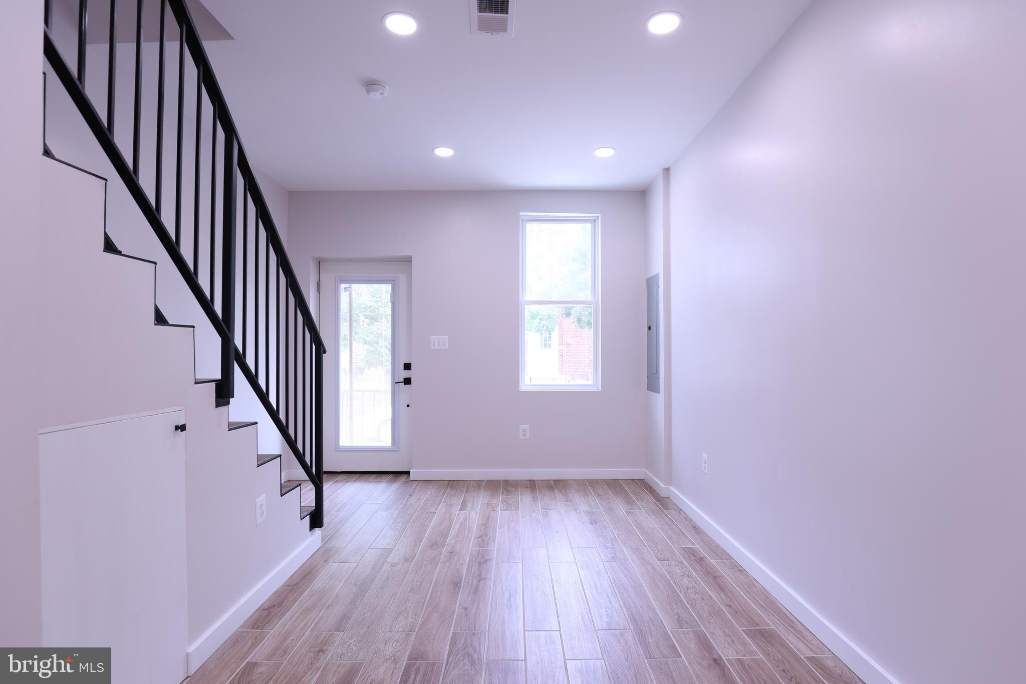 2039 Rosedale Street Northeast Washington, DC 20002 - Photo 6 of 18 an entryway and stairs with wooden floor