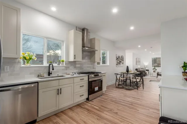 a kitchen with lots of counter top space and dining table
