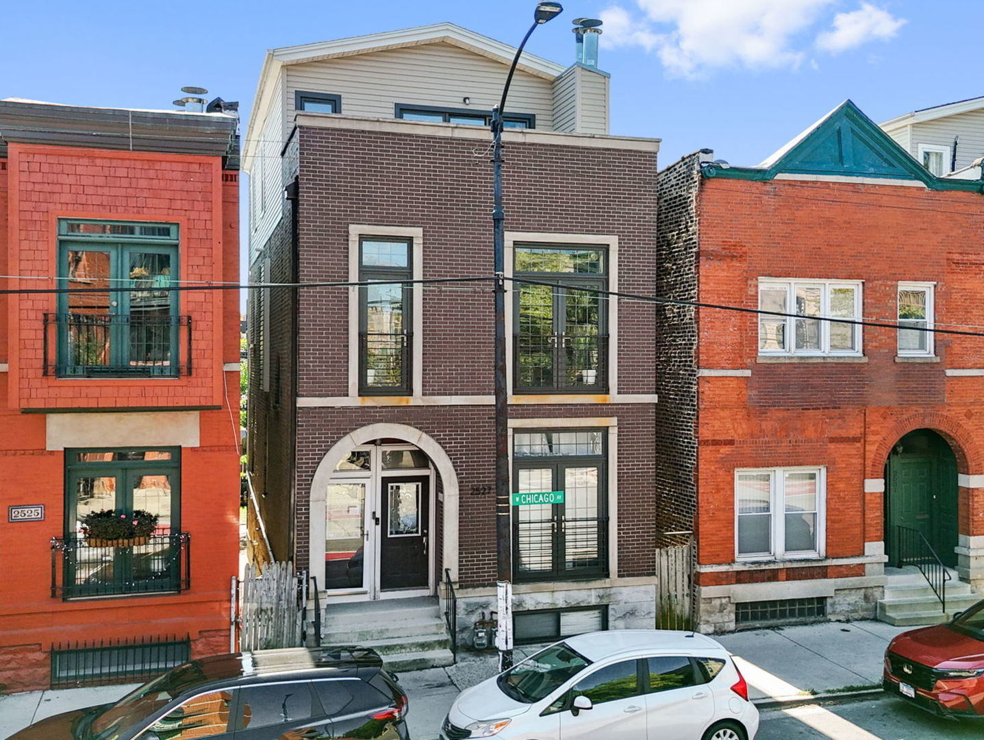 a front view of a houses on the street