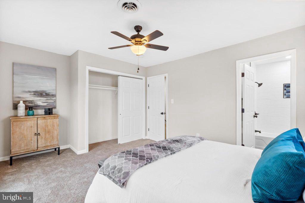 424 53rd Street Southeast Washington, DC 20019 - Photo 22 of 40 a bedroom with a bed and a chandelier