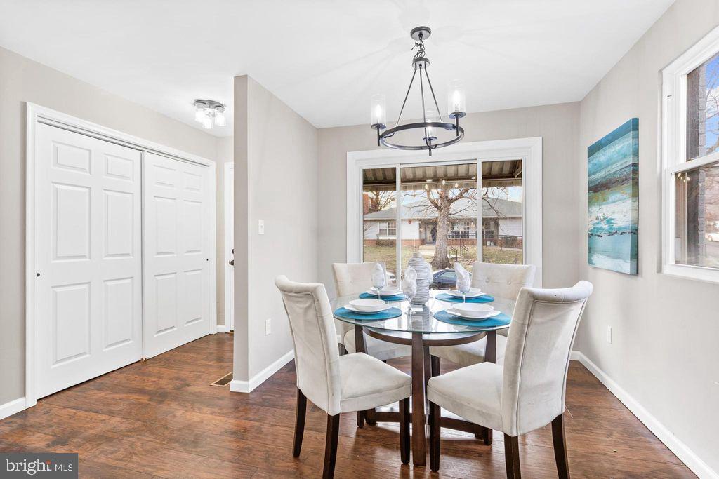 424 53rd Street Southeast Washington, DC 20019 - Photo 7 of 40 a dining room with furniture a chandelier and wooden floor