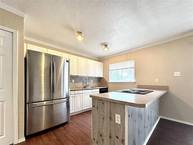 wooden floor in an empty room with a window and wooden floor