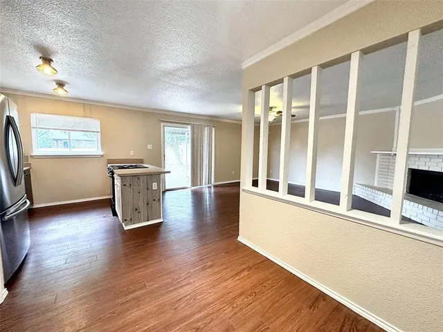 a bedroom with a large bed and a flat screen tv