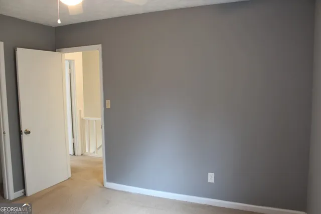 a white toilet sitting next to a window