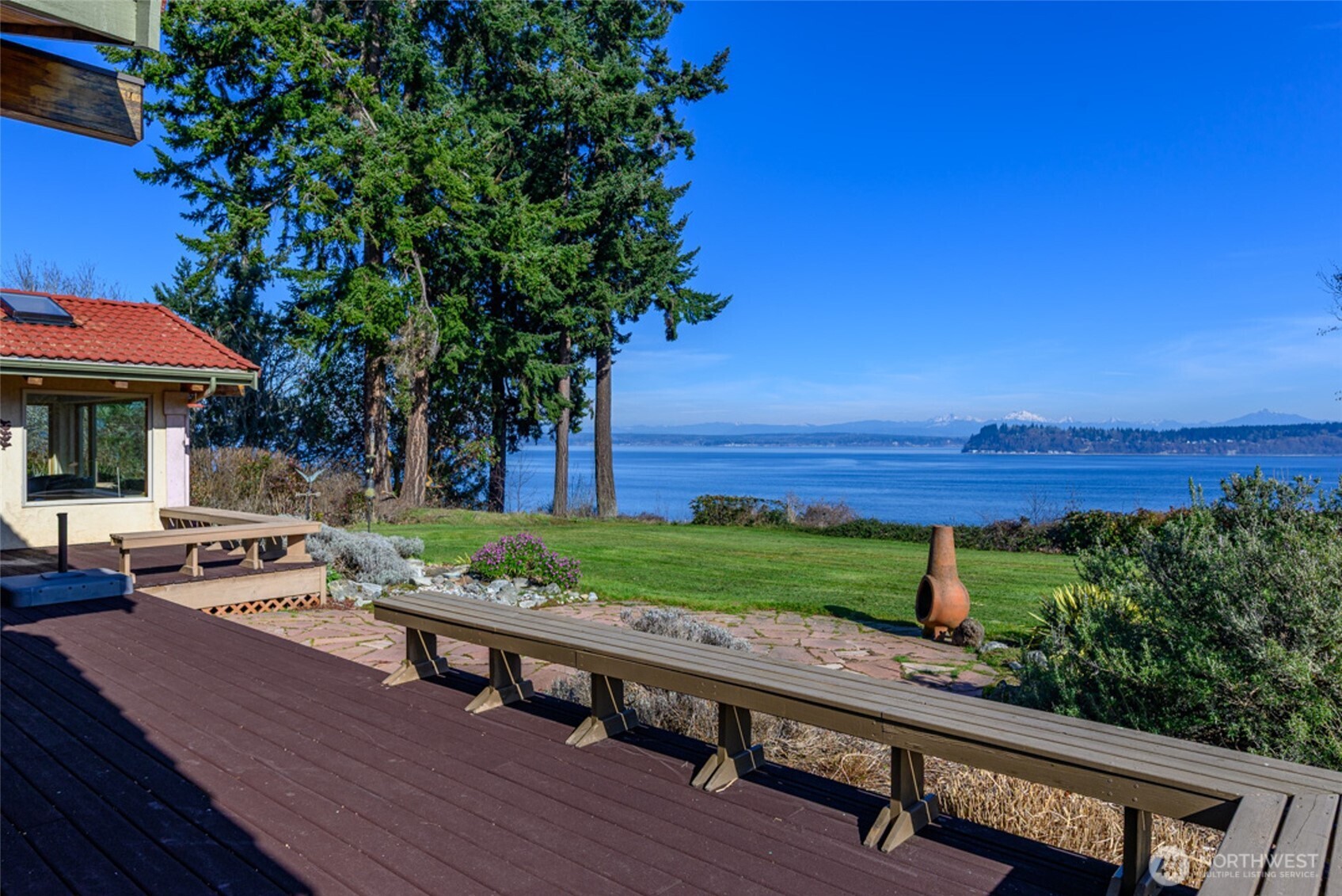 5477 Wilkinson Road Langley, WA 98260 - Photo 3 of 40 a view of a wooden floor with a bench in front of a house