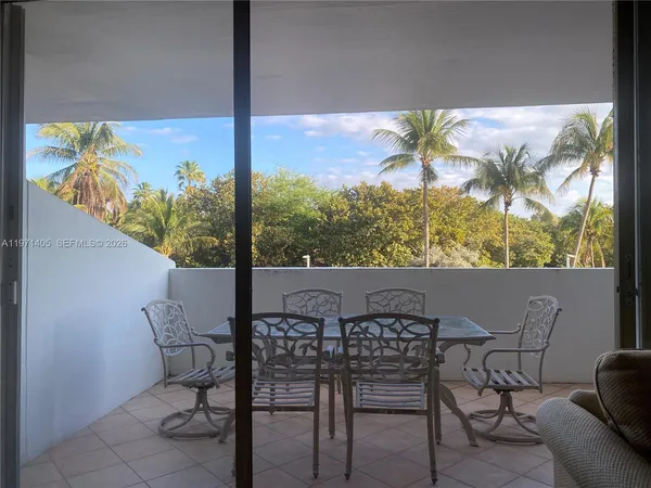 a living room with stainless steel appliances kitchen island granite countertop a sink and a stove