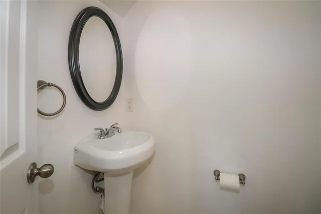 a bathroom with a sink and mirror