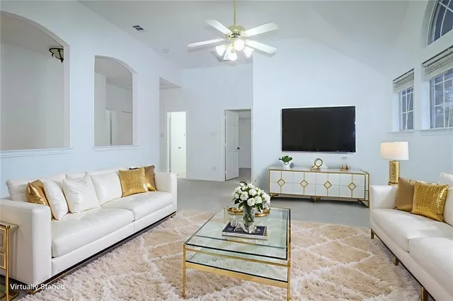 a living room with furniture and a flat screen tv