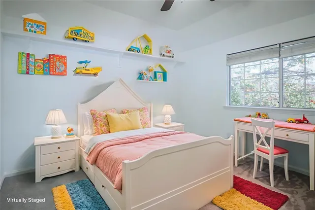 a bed room with a bed and a chair