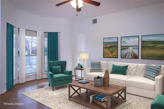 a living room with furniture and a rug