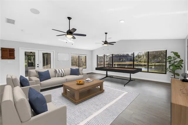 a bathroom with a granite countertop toilet and a sink
