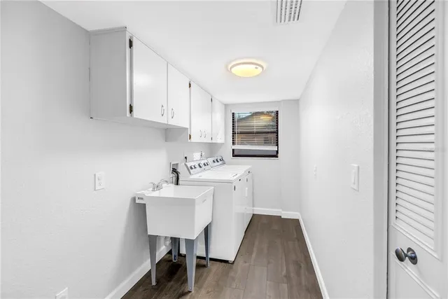 a bedroom with bed and a large window