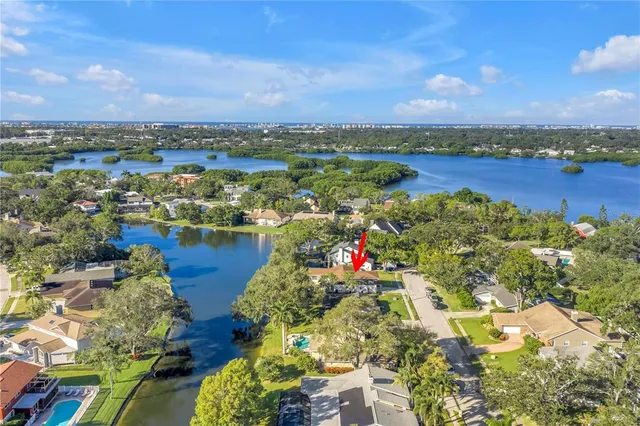 an aerial view of a house with a lake view