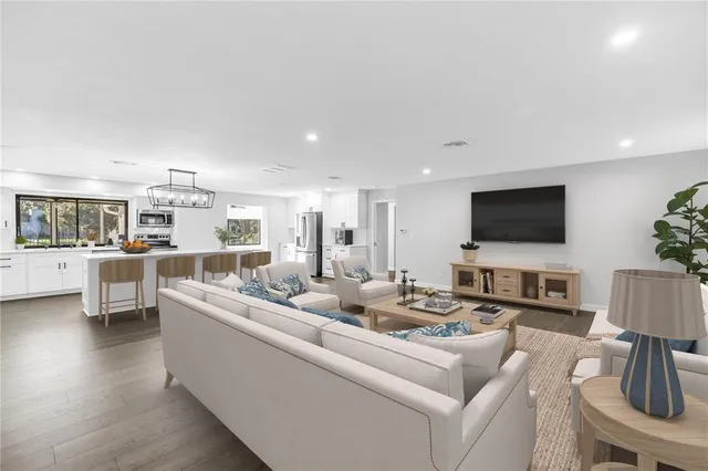 a dining table with chairs and chandelier