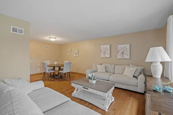 a living room with furniture and a table