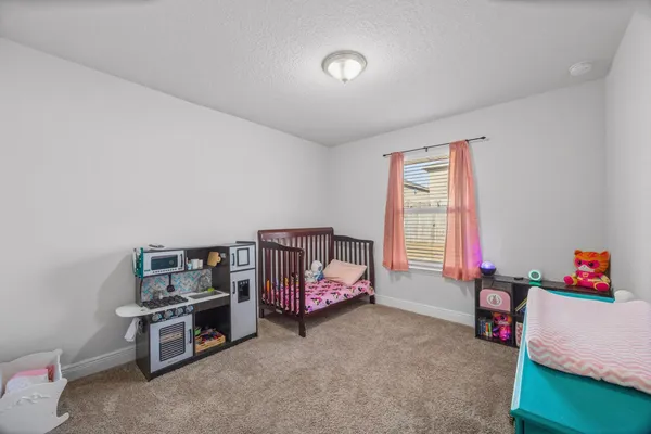 a bedroom with furniture and a window