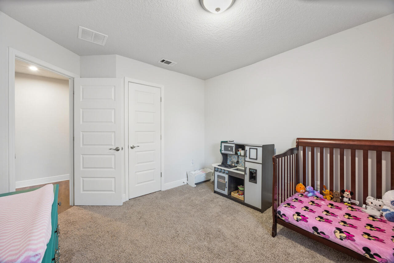 109 Ridgeway Circle Crestview, FL 32536 - Photo 12 of 18 a bedroom with furniture and a window