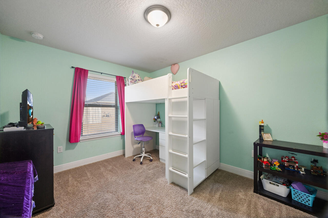 109 Ridgeway Circle Crestview, FL 32536 - Photo 13 of 18 a bedroom with furniture and a window