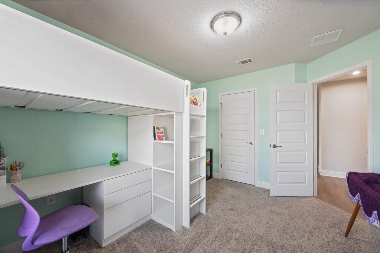 109 Ridgeway Circle Crestview, FL 32536 - Photo 14 of 18 a room with furniture and a dresser