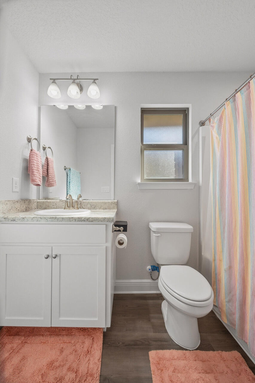 109 Ridgeway Circle Crestview, FL 32536 - Photo 15 of 18 a bathroom with a granite countertop toilet sink and mirror