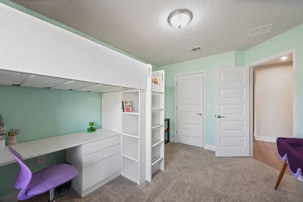 an aerial view of a house with a garden space