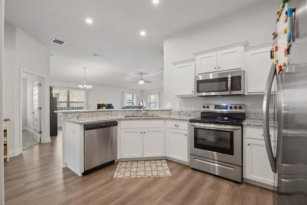 a bedroom with a bed and a tv