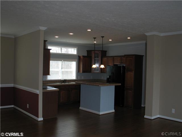 19600 Log Disputanta, VA 23842 - Photo 2 of 9 a kitchen with stainless steel appliances granite countertop a sink stove and refrigerator
