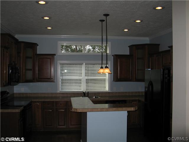 19600 Log Disputanta, VA 23842 - Photo 6 of 9 a kitchen with a sink and cabinets