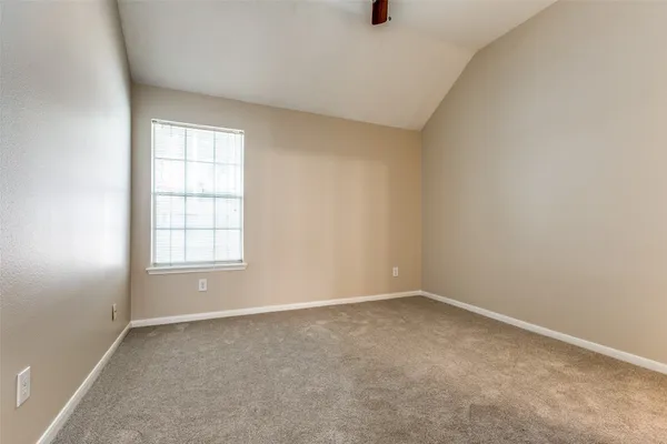 an empty room with a empty space and windows