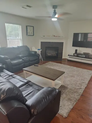 a living room with furniture and a fireplace
